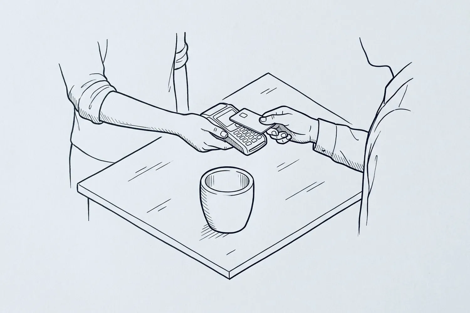 A seller holding a small card reader across a market table with one ceramic planter on it while a customer taps a card, both faces out of frame